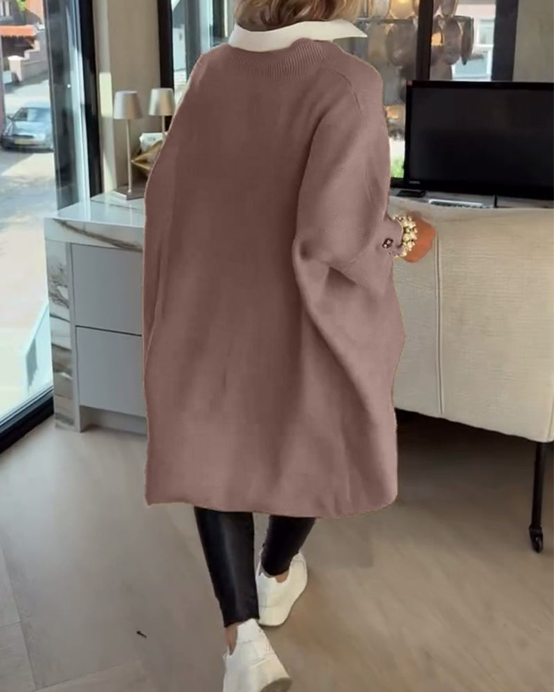 Pull con cuello en V, buttons y diseño asimétrico