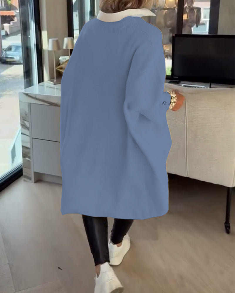 Pull con cuello en V, buttons y diseño asimétrico