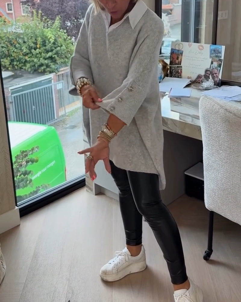 Pull con cuello en V, buttons y diseño asimétrico