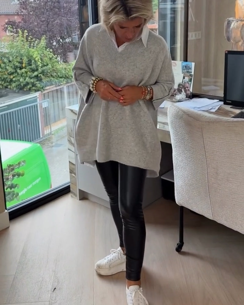 Pull con cuello en V, buttons y diseño asimétrico