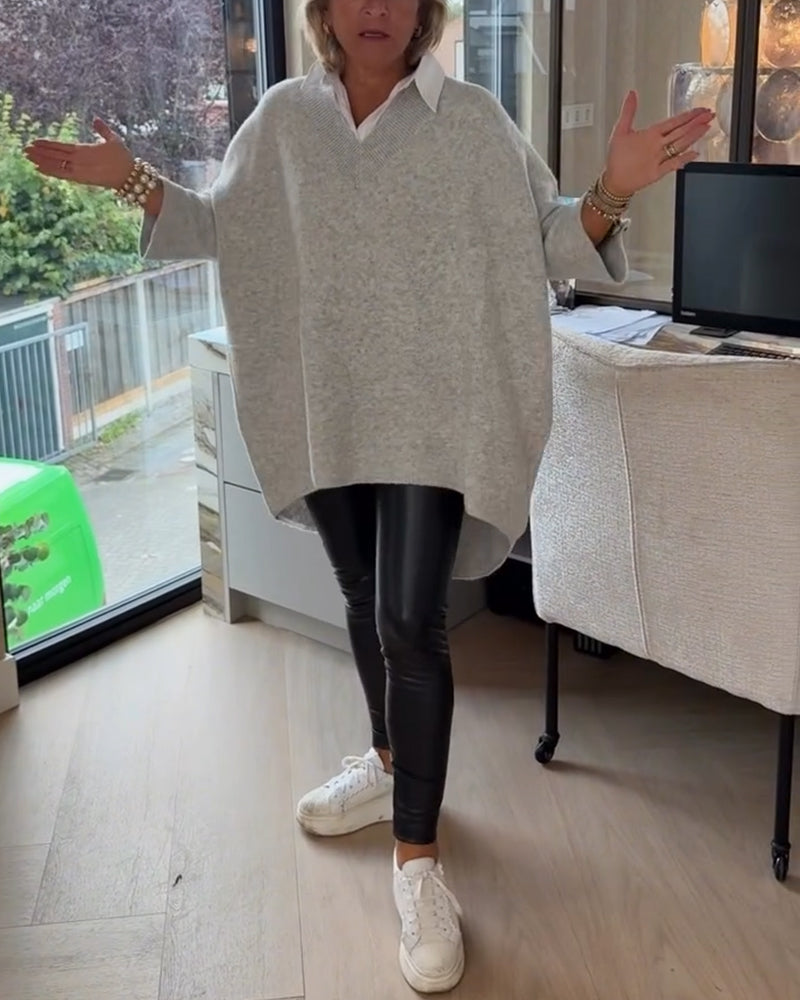 Pull con cuello en V, buttons y diseño asimétrico